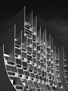 an abstract architectural photograph of a building against a cloudy sky