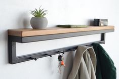 Transform your entryway with our Handmade Entryway Wall-Mounted Coat Rackfeaturing a stylish combination of industrial metal and rustic woodThis versatile coat rack is designed to enhance your hallway while providing a functional storage solutionWith a width of 28 inches and a sleek height of 4.7 inchesthis floating shelf effortlessly accommodates coatshatsand bagsThe integrated wooden towel rail adds an extra touch of conveniencemaking it perfect for busy homesThis farmhouse-inspired coat stan Modern Coat Hooks Entryway, Metal Coat Hooks, Industrial Entryway Ideas, Wall Mounted Coat Rack Entryway, Coat Hooks Entryway, Modern Coat Rack Wall, Wooden Towel Rail, Shelves With Hooks, Scandinavian Entryway