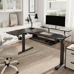 a computer desk with a monitor and keyboard on it