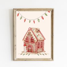 a watercolor painting of a gingerbread house hanging on a wall with christmas lights