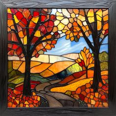 a stained glass window with trees and hills in the background, surrounded by autumn leaves