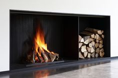 a fire place with logs in it