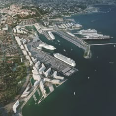 an aerial view of a city with boats in the water