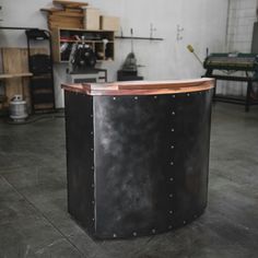 a large black metal table in a garage