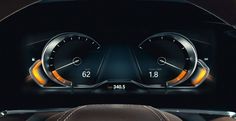 the dashboard of a car with speedometers showing