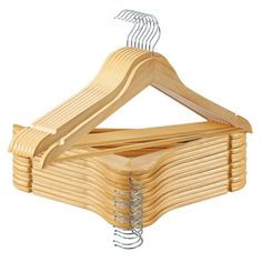 wooden clothes hangers stacked on top of each other