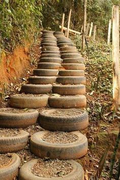 many old tires are stacked on each other