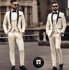 two men in white tuxedos standing next to each other