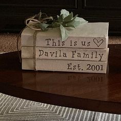 this is us personalized gift wrapped in brown paper and tied with a green bow