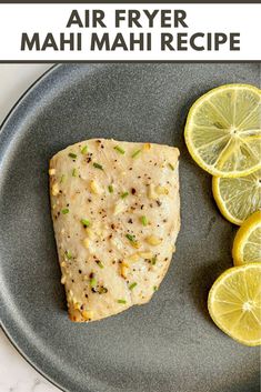 an air fryer mahi mahi recipe on a plate with sliced lemons