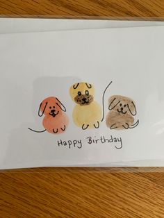 a card with three dogs and the words happy birthday written on it