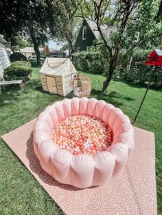 an inflatable pool is on the lawn