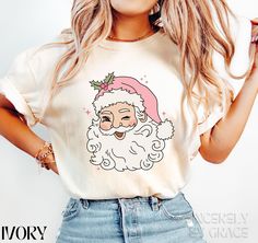 Get festive with this fun Pink Santa shirt, perfect for holiday parties, casual wear, or gifting this Christmas season. Featuring a unique twist on the classic Santa design, this shirt is a must-have for anyone looking to stand out during the holidays. Ideal for spreading cheer in style! Pink Santa Shirt, Retro Santa Shirt, Vintage Santa Tshirt, Santa Face Tee, Pink Christmas Santa T-shirt, Santa Claus Shirt Comfort Colors 100% cotton. Machine Washable * Refer to sizing guide in photos for sizes Rose Comfort, Santa Tshirt, Pink Santa, Retro Santa, Santa Shirt, Santa Shirts, Santa Face, Vintage Santa, Style Pink