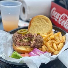 a sandwich and french fries on a tray