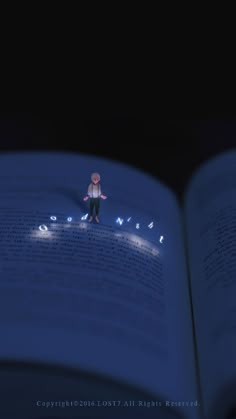 an open book with a person standing on top of it