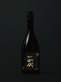 a bottle of wine with chinese writing on the label in front of a black background