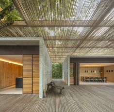 the inside of a house with wooden floors and walls, covered in bamboo slats