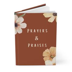 a brown and white book with flowers on the cover that says, prayer & praise