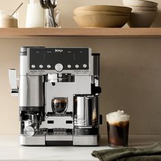 an espresso machine sitting on top of a counter