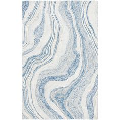 a blue and white rug with wavy lines