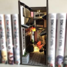 an open door to a room with many books