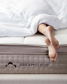 a person laying on top of a dream cloud mattress