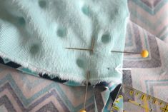 sewing needles and needle tips on fabric