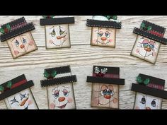 several small bags with faces painted on them sitting next to each other in front of a wooden table