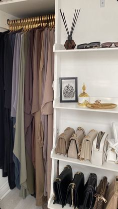 a white shelf filled with lots of shoes and handbags