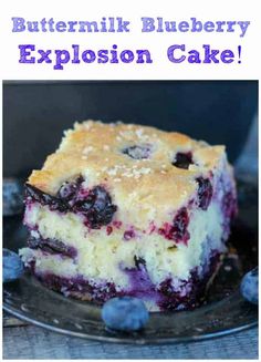 blueberry explosion cake on a plate with the words buttermik blueberry explosion cake