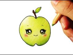 someone is drawing an apple with a pencil