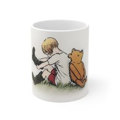 a coffee mug with an image of a boy and a bear on it