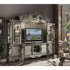 an ornate silver entertainment center in a living room