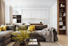 a living room filled with furniture and yellow pillows