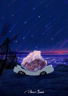 a car is parked in front of a large rock with stars falling from the sky