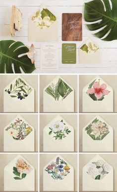 the wedding stationery is laid out with flowers and greenery on it, along with matching envelopes