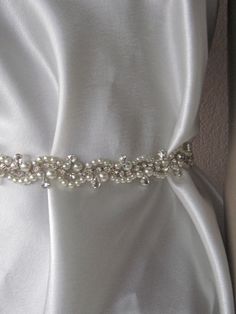 Express Shipping Pearl Crystal rhinestones wedding dress belt pearl belt This is a bridal Sash which you can use in y our most important day. ThisBelt finish with the ribbon. It is 60cm long but i am offen to make custom order, just contact me and let me know which size do you need. The stones are so shiny like the happy briedes. The product is made in smokefree and hygienic place. It wil bel packaged very carefully. I send it via local post service. If you want express delivery please contact m Elegant Pearl Embellished Sashes For Party, Elegant Embellished Sashes For Party, Elegant Embellished Sashes, Elegant Bridal Sashes For Bride, Elegant Bridal Sashes, Elegant Beaded Silver Sashes, Elegant Silver Beaded Sash, Elegant Embellished Bridal Belt For Wedding, Elegant Embellished Bridal Belt For Mother Of The Bride