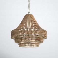 a wooden chandelier hanging from a chain