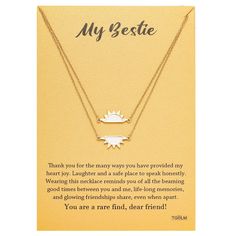 a card with a gold necklace on it