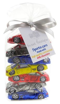 five sports cars packaged in cellophane and tied to a white ribbon with a tag