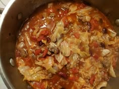 a pot filled with lots of food on top of a stove