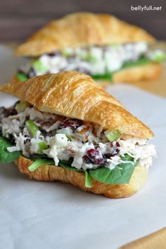 a croissant sandwich with chicken salad on it