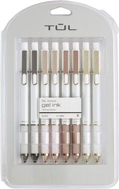 an assortment of pens in a clear package