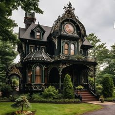 an ornate victorian style house in the woods