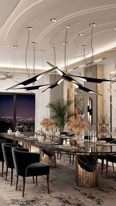 an elegant dining room with black chairs and marble table surrounded by chandeliers that hang from the ceiling