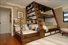 a bunk bed in the corner of a room with a ladder on it's side