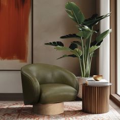 a green chair sitting next to a tall plant in a living room filled with furniture