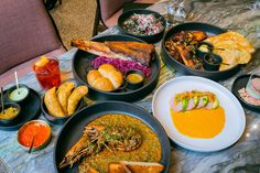 a table topped with lots of different types of food