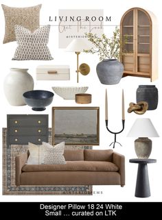 the living room is decorated in neutral tones and gold accents, including pillows, vases,