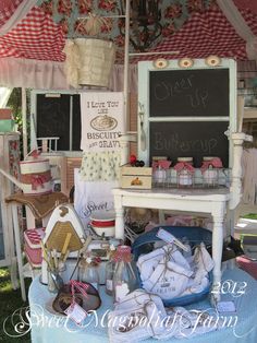 a table with many items on it under an umbrella